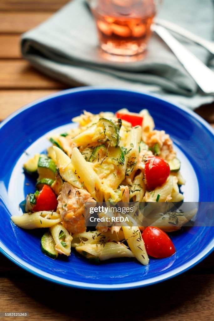 Pennette cold pasta with salmon. zucchini. cherry tomatoes and thyme