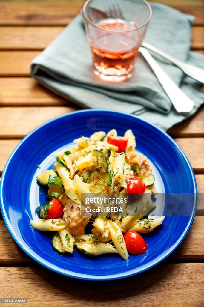 Pennette cold pasta with salmon. zucchini. cherry tomatoes and thyme