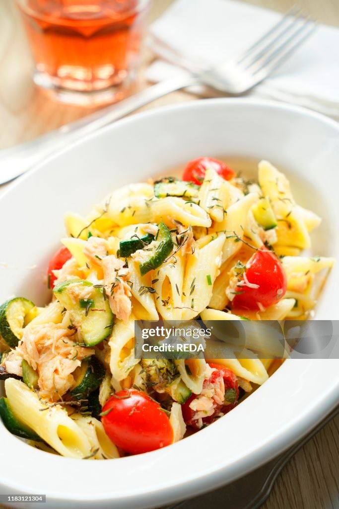 Pennette cold pasta with salmon. zucchini. cherry tomatoes and thyme