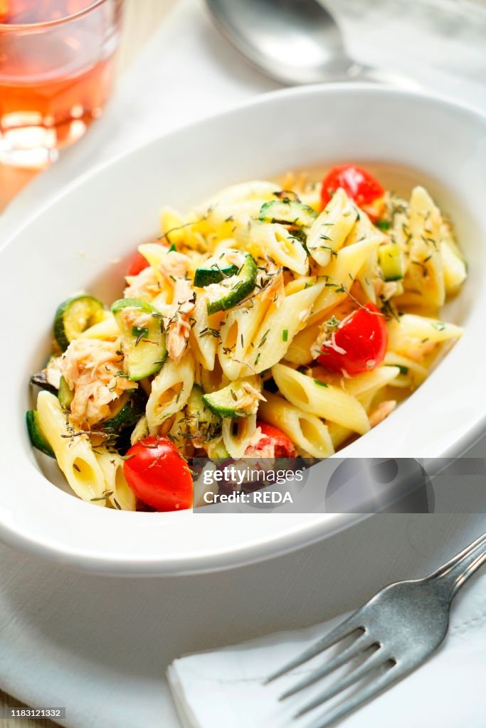 Pennette cold pasta with salmon. zucchini. cherry tomatoes and thyme