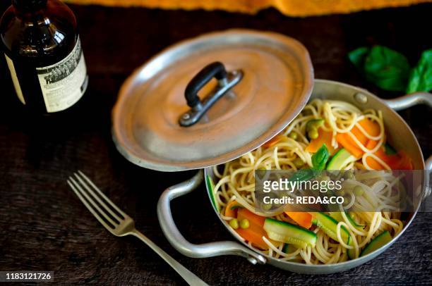 Spaghetti with carrots. Zucchini and peas. Whole wheat pasta with carrots. Zucchini and peas. Italy.