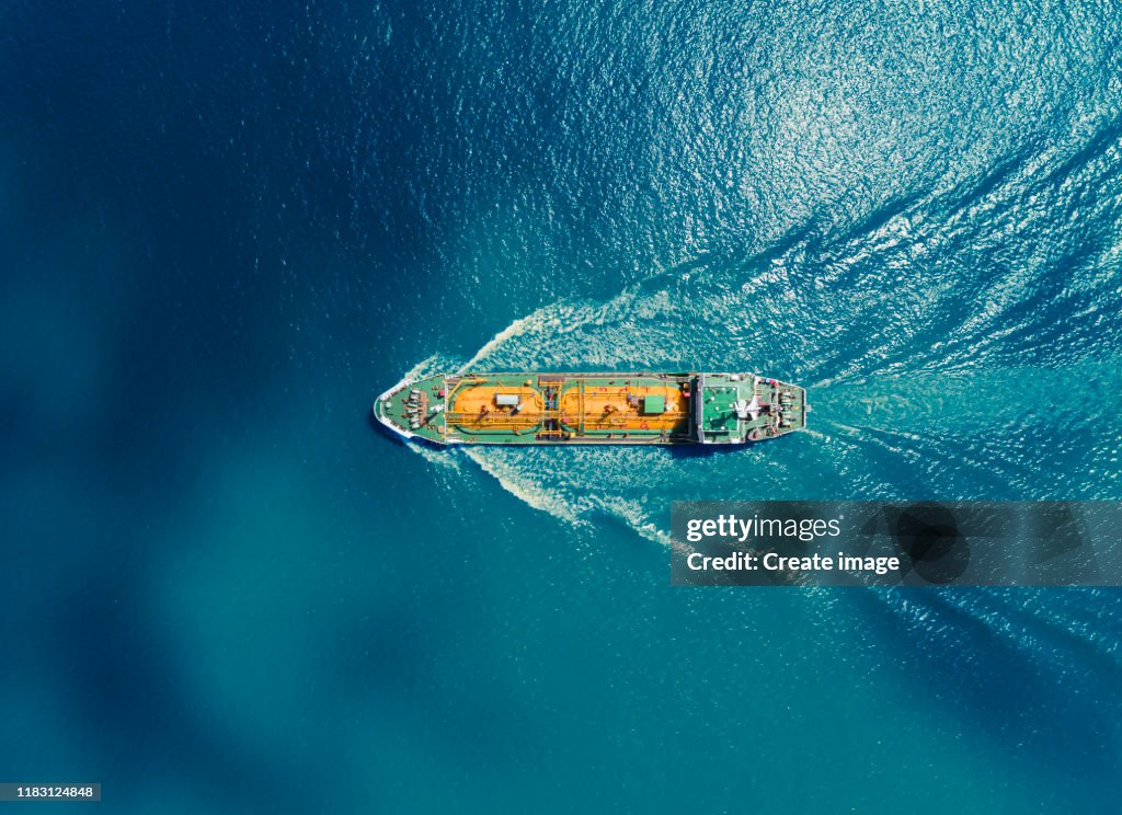 Aerial top view Oil or LPG ship tanker transportation Oil/LPG from refinery on the blue sea.