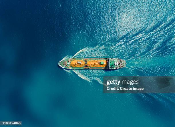 aerial top view oil or lpg ship tanker transportation oil/lpg from refinery on the blue sea. - ship above stock pictures, royalty-free photos & images