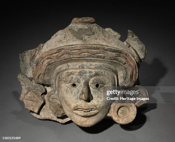 Urn Figure Head Fragment, c. 200-500. The face of this fragmentary urn figure is modeled with exceptional sensitivity. The downward gaze of the...