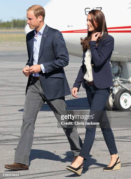 Catherine, Duchess of Cambridge and Prince William, Duke of Cambridge board a Canadian Airforce jet to Slave Lake at Yellowknife Airport on July 6,...
