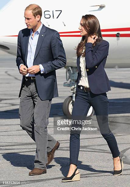 Catherine, Duchess of Cambridge and Prince William, Duke of Cambridge board a Canadian Airforce jet to Slave Lake at Yellowknife Airport on July 6,...