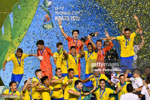 Brazil players celebrate with the World Cup Trophy after winning the final of the FIFA U-17 Men's World Cup Brazil 2019 against Mexico at Bezerrao...