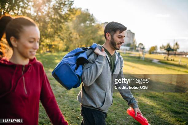 young caucasian couple preparing for workout - gym bag stock pictures, royalty-free photos & images