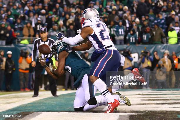Nelson Agholor of the Philadelphia Eagles cannot make the catch against J.C. Jackson of the New England Patriots in the fourth quarter at Lincoln...