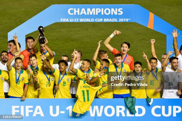 The Brazil side celebrate with the World Cup Trophy after winning during the Final of the FIFA U-17 Men's World Cup Brazil 2019 final match Mexico...