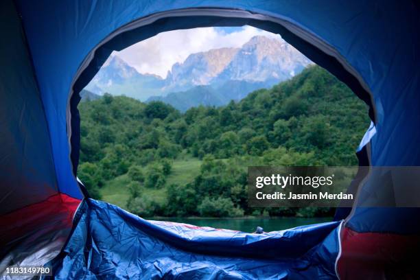 view from tent to the mountain - camping indoors stock pictures, royalty-free photos & images