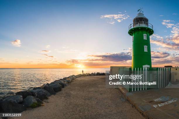 fremantle lighthouse at sunset, western australia - fremantle foto e immagini stock