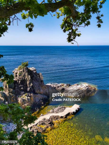 little port by the helligdomsklipperne rocky coastline in the vicinity of gudhjem, bornholm island, denmark. - bornholm stock pictures, royalty-free photos & images