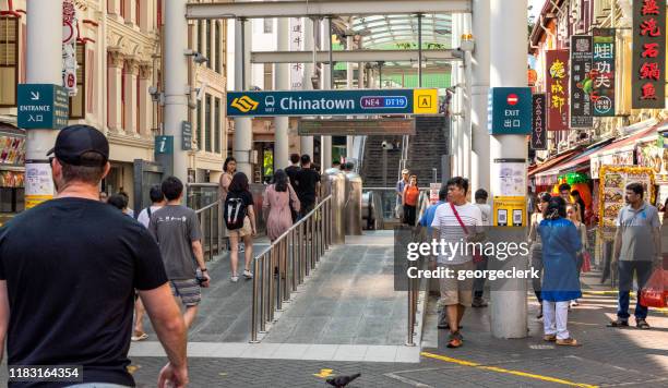 singapore: entrance to mrt chinatown station - singapore mrt stock pictures, royalty-free photos & images