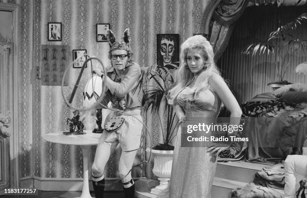 Comedian Graeme Garden and actress Liz Fraser in a sketch from episode 'Caught in the Act' of the BBC television series 'The Goodies', 1970.