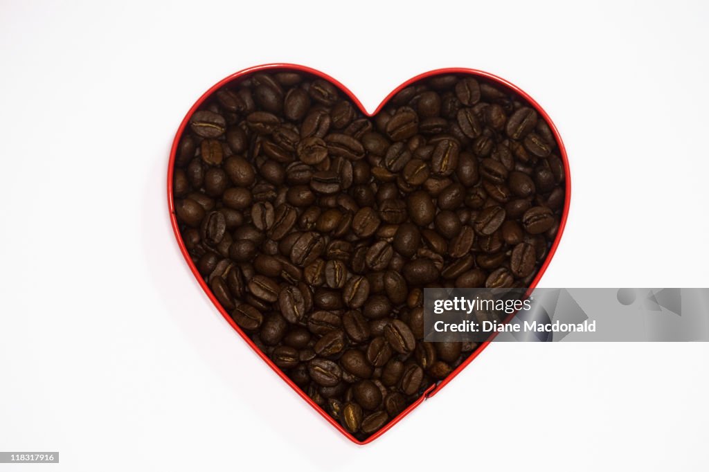 Coffee beans in a heart shaped cookie cutter