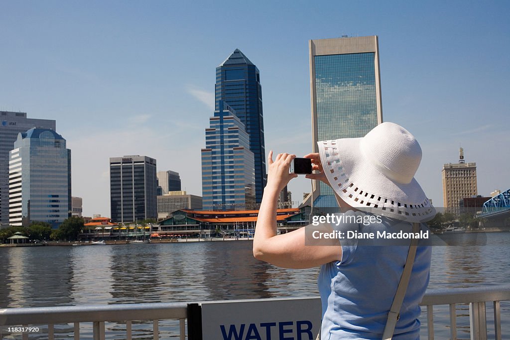 A tourist taking a photo of the skyline