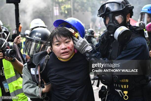 Protesters are detained by police near the Hong Kong Polytechnic University in Hung Hom district of Hong Kong on November 18, 2019. Pro-democracy...