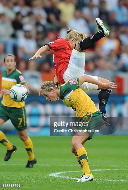Lene Mykjaland of Norway jumps above Elise Kellond-Knight of Australia during the FIFA Women's World Cup 2011 Group D match between Australia and...