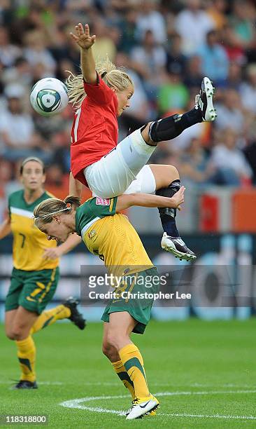 Lene Mykjaland of Norway jumps above Elise Kellond-Knight of Australia during the FIFA Women's World Cup 2011 Group D match between Australia and...