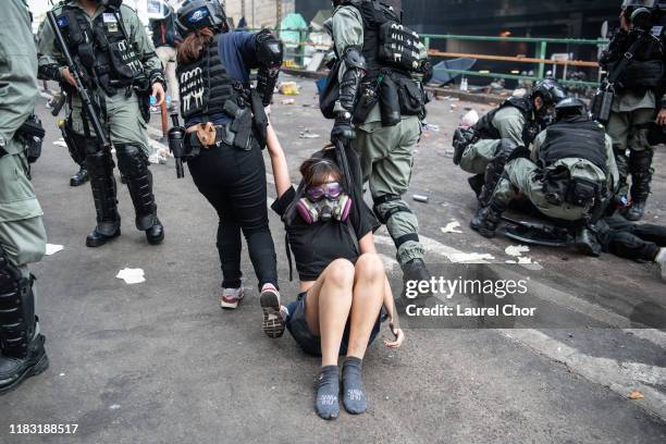 Police arrest anti-government protesters at Hong Kong Polytechnic University on November 18, 2019 in Hong Kong, China. Anti-government protesters...