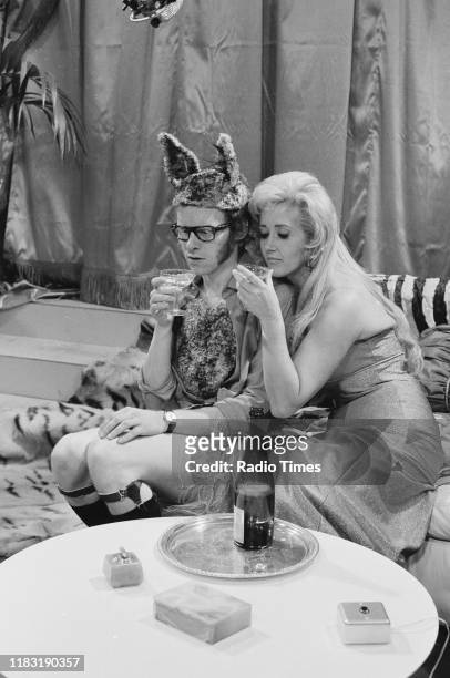 Comedian Graeme Garden and actress Liz Fraser in a sketch from episode 'Caught in the Act' of the BBC television series 'The Goodies', 1970.
