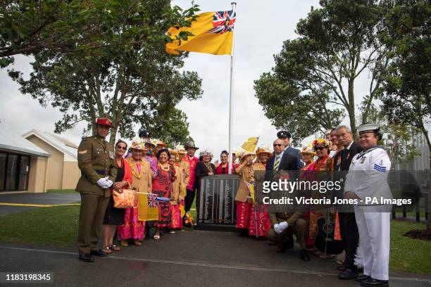 People from the island of Niue in the South Pacific welcome the Prince of Wales and the Duchess of Cornwall as they arrive for a wreath laying...