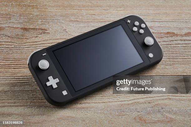 Nintendo Switch Lite handheld video games console with a Gray finish, taken on November 7, 2019.