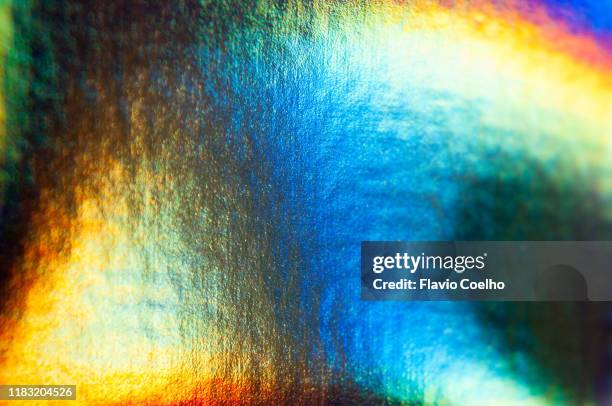 iridescent background in white, blue and orange - iridescent stockfoto's en -beelden