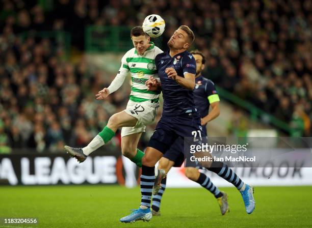 Callum McGregor of Celtic and Sergej Milinkovic-Savic of Lazio compete for the ball during the UEFA Europa League group E match between Celtic FC and...