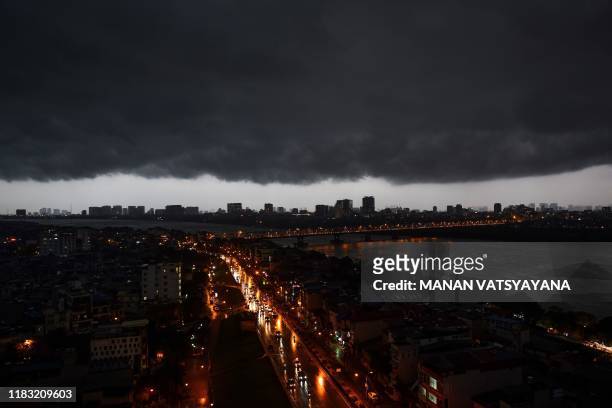 Dark clouds are seen over the Hanoi skyline on November 18, 2019.