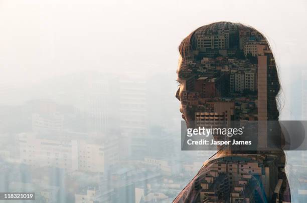 double exposure of woman and cityscape - sehen stock-fotos und bilder