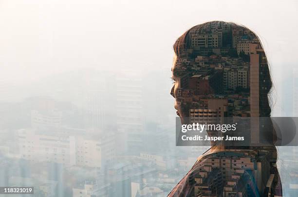 double exposure of woman and cityscape - blend bildbanksfoton och bilder