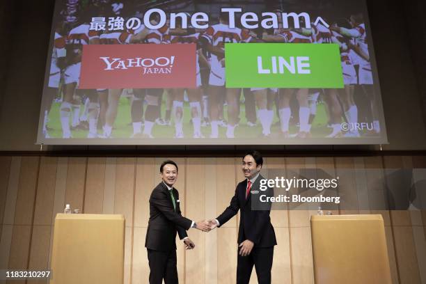 Kentaro Kawabe, president and chief executive officer of Z Holdings Corp., formerly known as Yahoo Japan, left, and Takeshi Idezawa, chief executive...