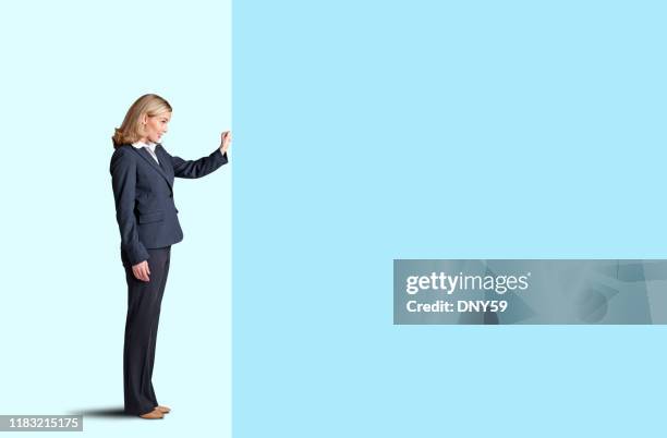 businesswoman knocking on door - knocking stock pictures, royalty-free photos & images