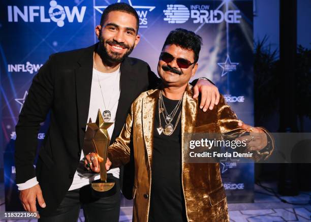 Justsul and Said Ahmad pose with their awards during the Inflow Global Awards 2019 at the Four Seasons Bosphorus Hotel on October 22, 2019 in...