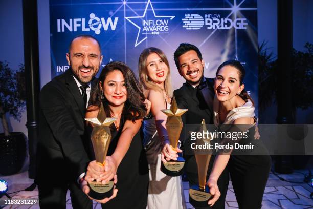 Dilara Kocak and her team pose with their awards Best Healthy Living Influencer Campaign during the Inflow Global Awards 2019 at the Four Seasons...