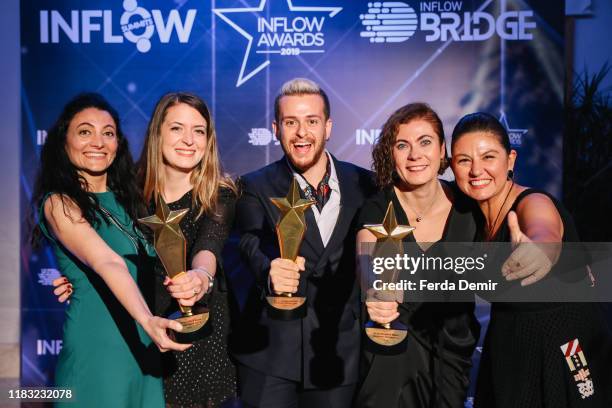 Alper Rende, Burcu Karakuz, Gulden Tatlıtoma pose with their awards Best Beauty & Care Influencer Campaign during the Inflow Global Awards 2019 at...