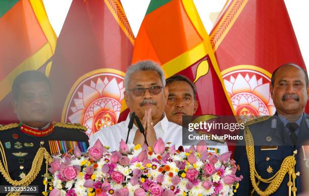 Sri Lanka's newly elected president Gotabaya Rajapaksa greets after addressing the nation at the historic Ruwanweli Seya Buddhist temple in the first...