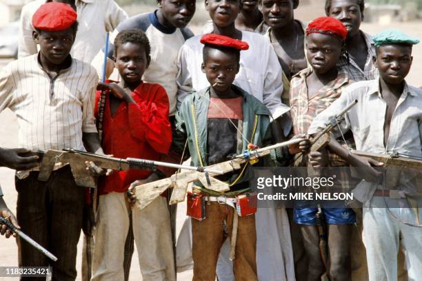 Young Chadian boy scouts pose with wooden rifles, on February 23 in Doba during the Chadian-Libyan conflict.