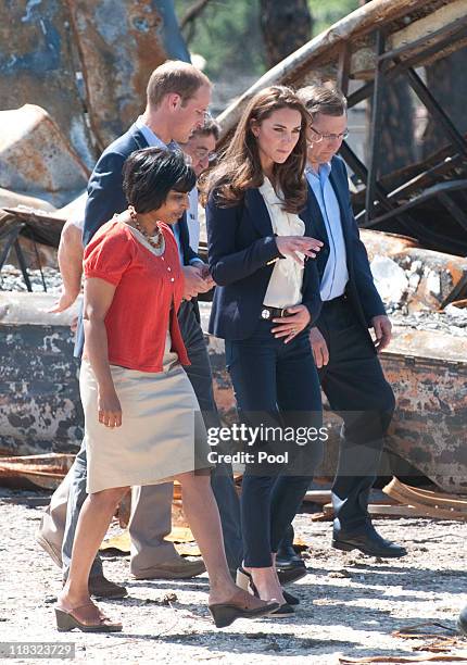 Prince William, Duke of Cambridge and Catherine, Duchess of Cambridge visit a part of town devastated by a fire in May 2011, on July 7, 2011 in Slave...