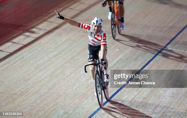 Andreas Muller of Austria celebrates after crossing the line after the Men's Madison Chase during Day Three of the London SIx Day Cycling at Lee...