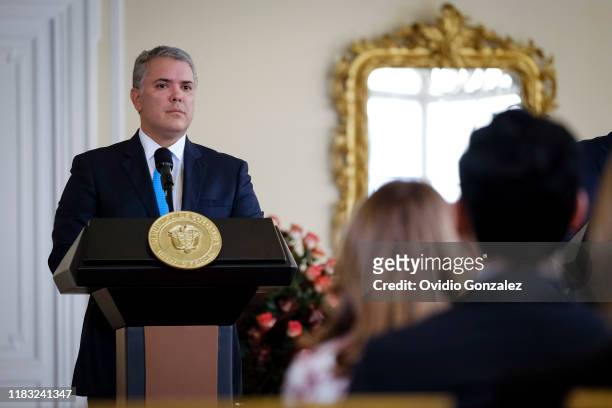 President of Colombia Ivan Duque listens to José Ángel Gurría , Secretary General of the Organization for Economic Cooperation and Development on...