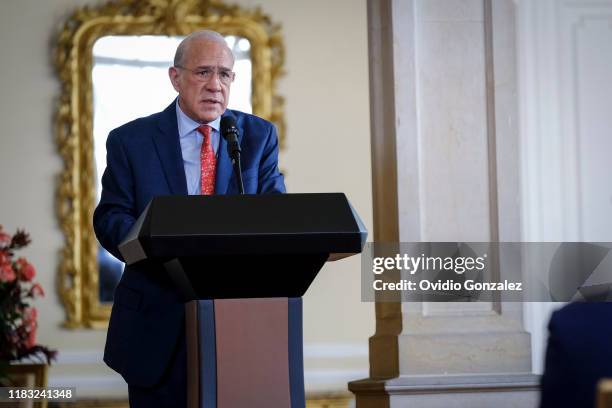 José Ángel Gurría, Secretary General of the Organization for the OECD, addresses the President of Colombia Ivan Duque Marquez and congratulates the...