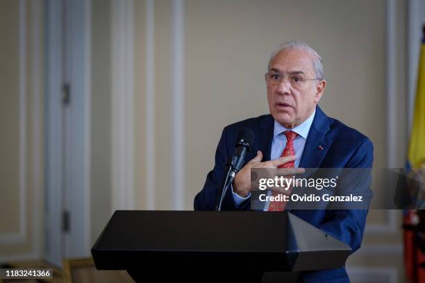 José Ángel Gurría, Secretary General of the Organization for the OECD, addresses the President of Colombia Ivan Duque Marquez and congratulates the...