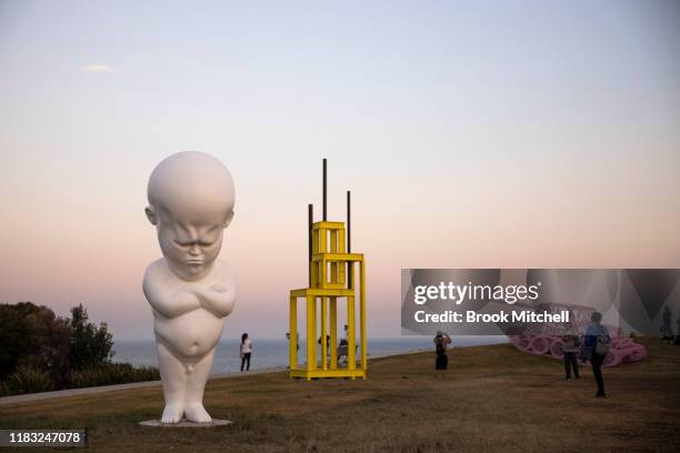 Sculpture by Slovakian artist Viktor Freso titled 'Angry Boy' is pictured before sunrise at Sculpture By The Sea at Bondi Beach on October 25, 2019...