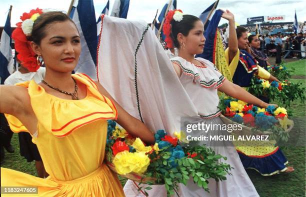 Students wearing traditional Central American folk clothing march in a parade 14 September, 1999 in Managua to commemorate Nicaragua's 178th...