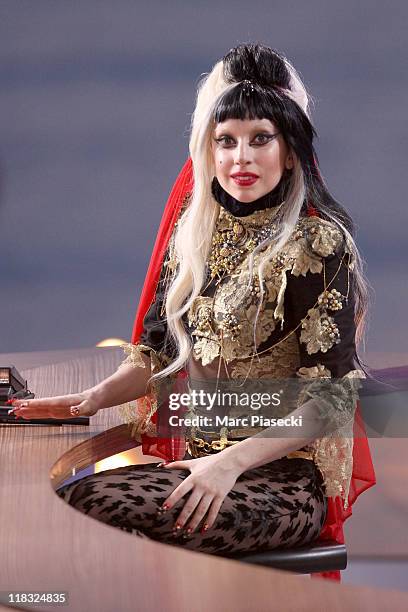 Lady Gaga attends the 'Le Grand Journal' tv show at Martinez Beach Pier on May 11, 2011 in Cannes, France.