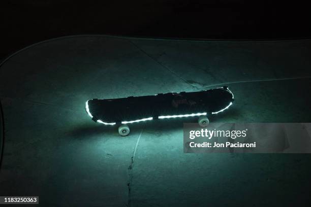 illuminated skateboard in sea foam green - denver art stock pictures, royalty-free photos & images
