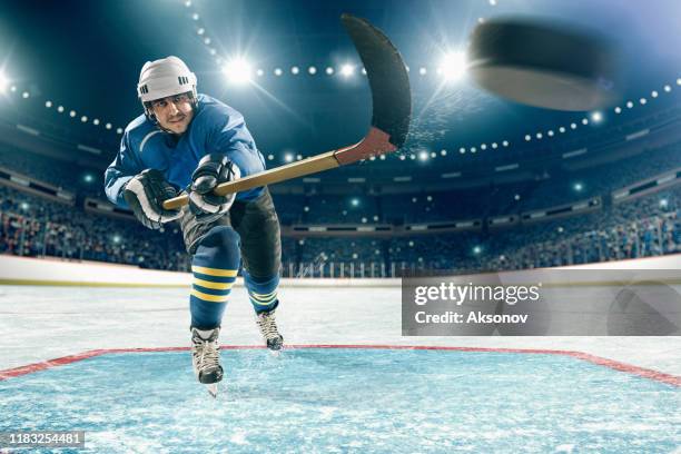 ice hockey player in action - ice hockey player stock pictures, royalty-free photos & images